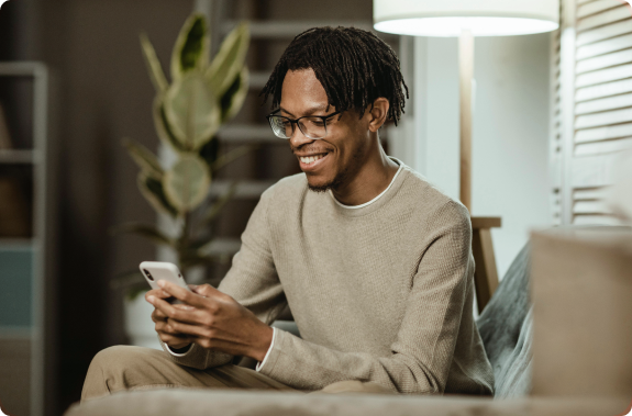 photo black man using cell phone smiling